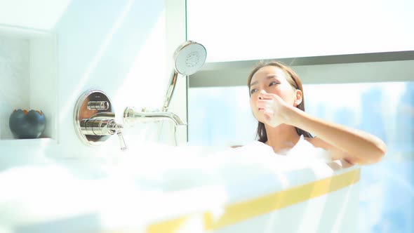 Young asian woman relax in bathtub