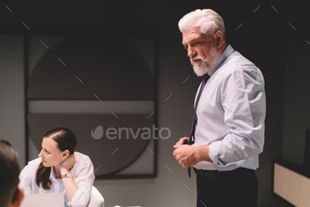 Bearded businessman talking during meeting