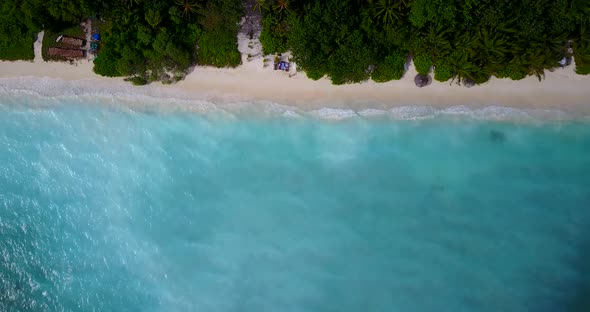 Beautiful flying island view of a white paradise beach and turquoise sea background in colorful 4K