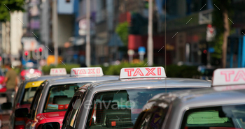 Taxi Sign in red color, moving in city