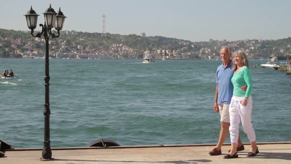 Couple walking on Promenade at the Bosphorus river Turkey, Istanbul