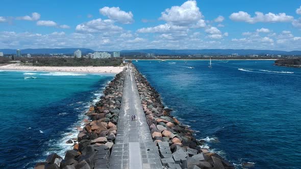 Arial view of a seaway wall created using large blocks which allow boats to enter and exit safely