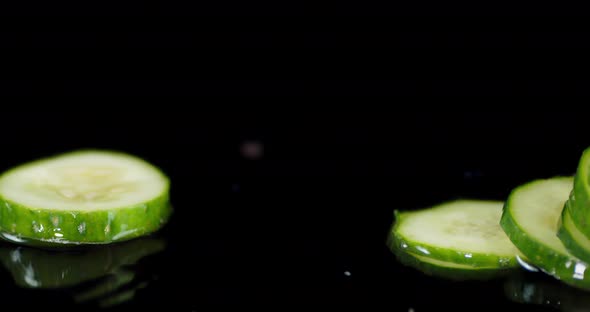 Cucumber Slices Fall on the Water Splashes. 