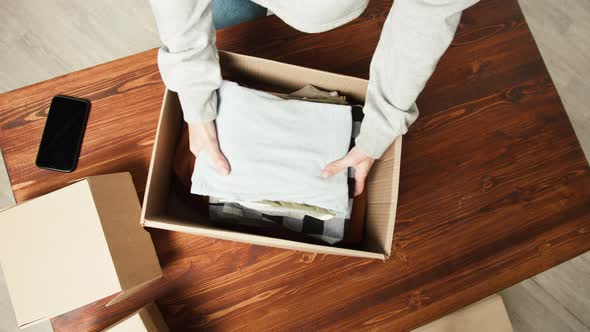 Woman Using Online Selling of Second Hand Clothes