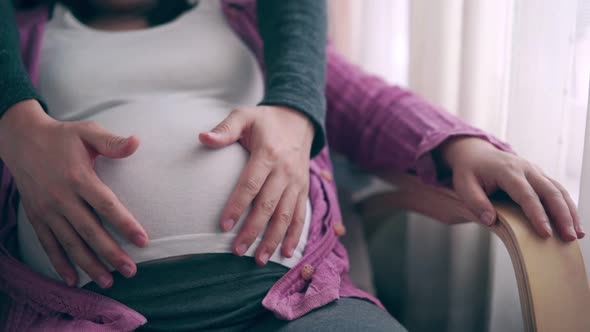 Pregnant Couple Feels Love and Relax at Home