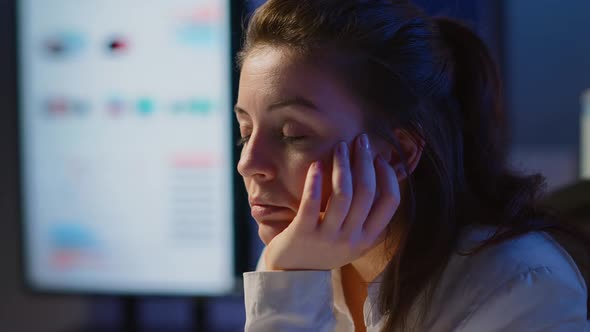 Businesswoman Working Until Midnight on Project Falling Asleep