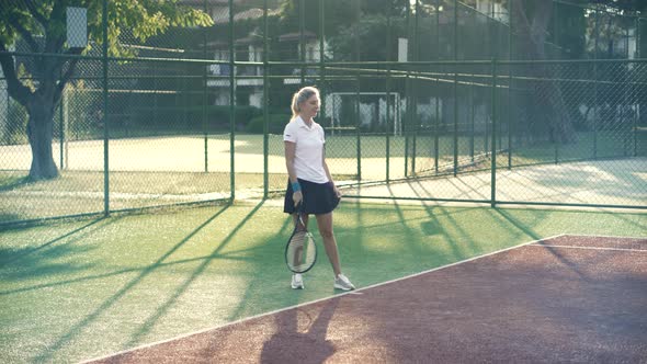 Girl Tennis Player With Racket. Sport Woman In Sportwear Playing Match.