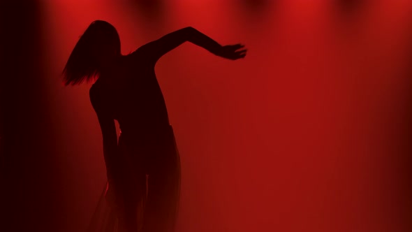 Modern Contemp Dance and Slim Flexible Dancer During Dance Practice in a Dark Studio with Red Lights