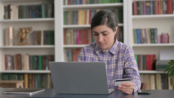 Indian Woman making Successful Online Payment on Laptop