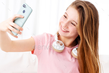 Teen making selfie on phone
