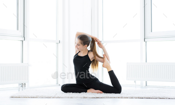 Pretty girl performing acrobatics
