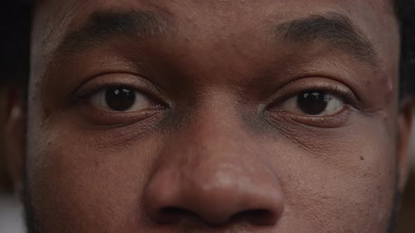 Extreme Closeup of a Surprised Africanamerican Man's Eyes