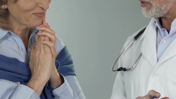 Woman Hearing from Doctor Joyful News of Her Full Recovery After Serious Illness