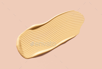 creamy cosmetic texture of golden shining color cosmetic smear
