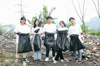 Volunteers With Trash Bag