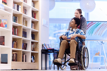 Boy with Disability Choosing Books in Library with Girl Assisting