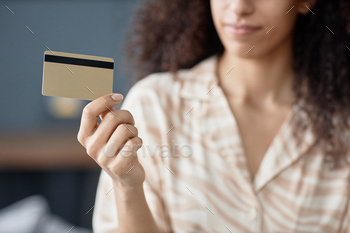Young Woman Holding Bank Card