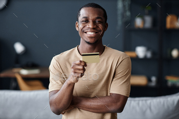 Cheerful Black Guy Holding Credit Card