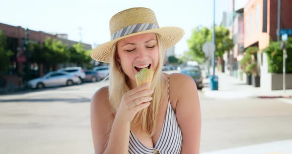 Smiling Sexy Young Attractive Woman Looking Into Camera and Eating Ice Cream, 