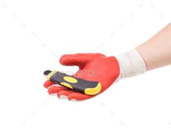 Hand in gloves holding knife.