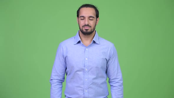 Young Happy Bearded Indian Businessman Relaxing with Eyes Closed