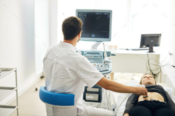 talented therapist working with ultrasound machine
