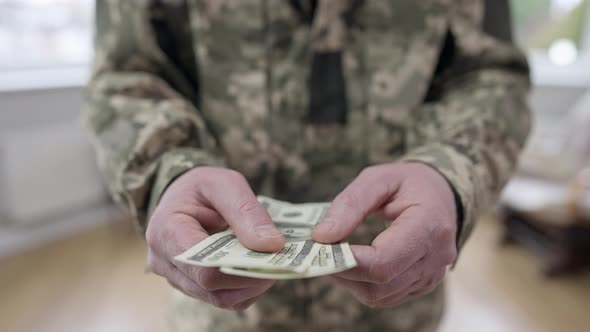 Male Caucasian Hands Holding Dollars