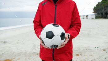 Soccer Ball In The Hands Of A Man