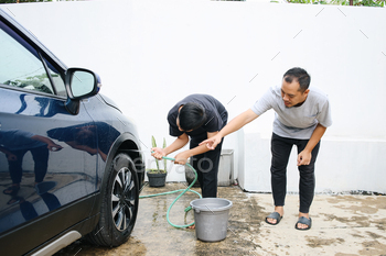Son Helping To Washing Car