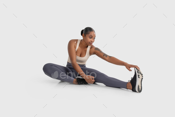 Woman Performing Stretching Exercise on the Floor