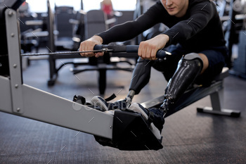 disabled person uses a rowing machine