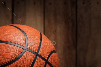 Basketball ball lying on a wooden floor