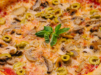 Freshly baked mushroom and olive pizza