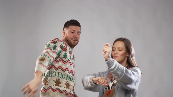 Happy Couple Dancing at Christmas Party