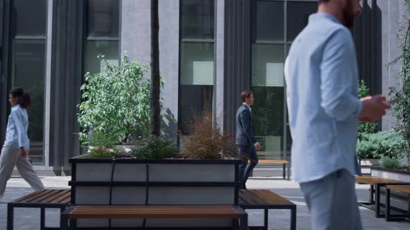 Confident Business Woman Walking to Work Occupation in Modern Gray Office Yard