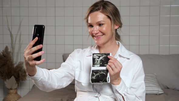 Pregnant Lady Shows Ultrasound Picture Via Video Call