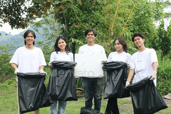 Volunteer Collecting Trash Together