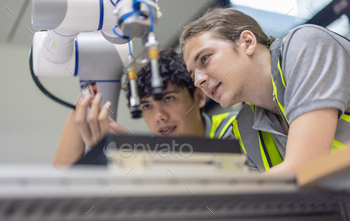 Trainees focus on robot arms, automation programs, and essential skills in the robotics academy.