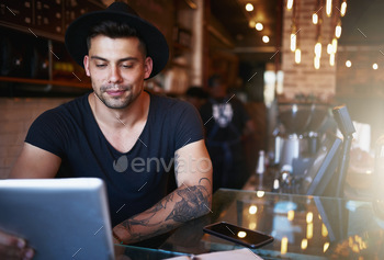 Keeping tabs on the performance of his coffee shop