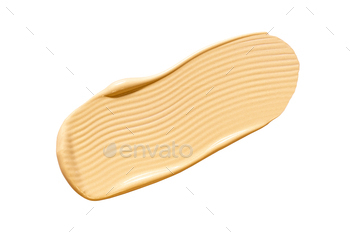 creamy cosmetic texture of golden shining color cosmetic smear on a white background