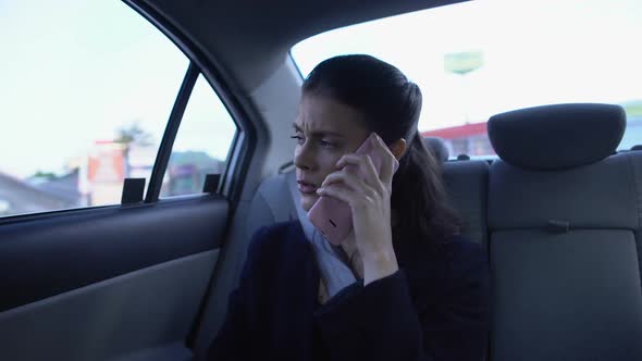 Businesswoman Sitting on Backseat and Talking on Phone, Stressful Job, Transport