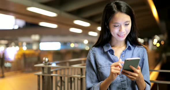 Young Woman Use of Smart Phone in City 