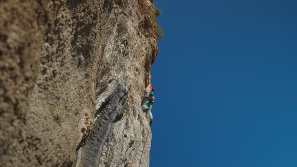 Strong Handsome Man Rock Climber Climbs Up Sunny Limestone Wall By Challenging Route