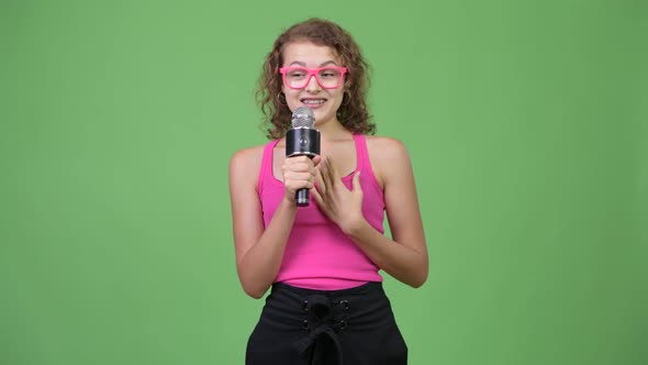 Young Anxious Nerd Woman Presenting Something While Looking Nervous