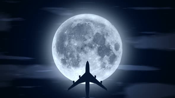 Passenger Airplane Over Moon in Cloudy Night alt