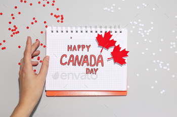 The inscription Happy Canada Day in a notebook