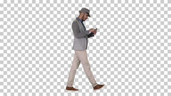 Serious arabic casual man using smartphone while walking Alpha