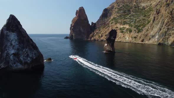 Happy People Swim on Air Mattress Behind a High Speed Water Bike