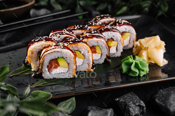 Exquisite sushi roll platter on elegant dark background