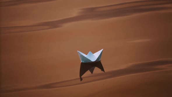 Dark background of water surface and paper ship floating in the evening.